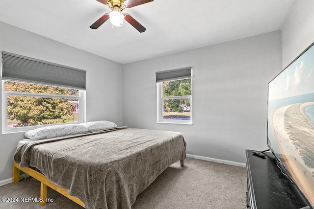 carpeted bedroom featuring ceiling fan