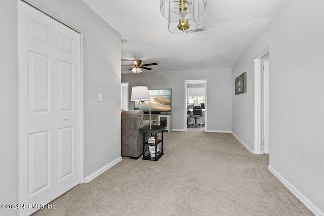 hallway with light colored carpet