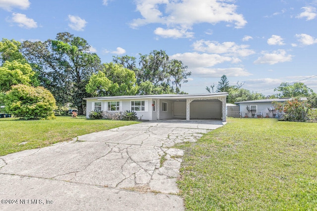 ranch-style home featuring a front yard and a carport