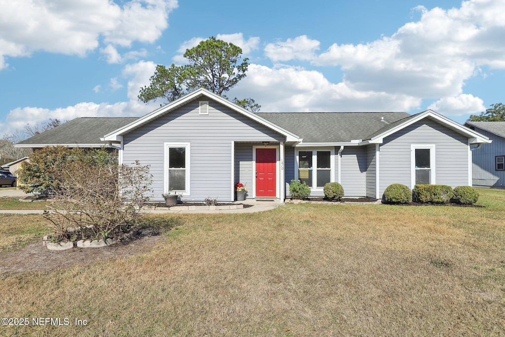 ranch-style house with a front yard