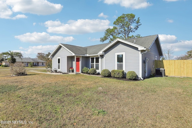 ranch-style home with a front lawn and cooling unit