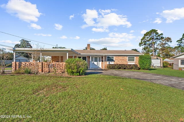 ranch-style home with a front lawn