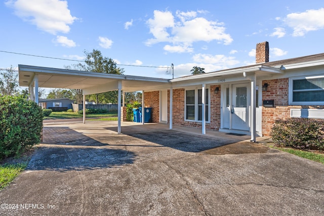 view of front of home featuring a carport