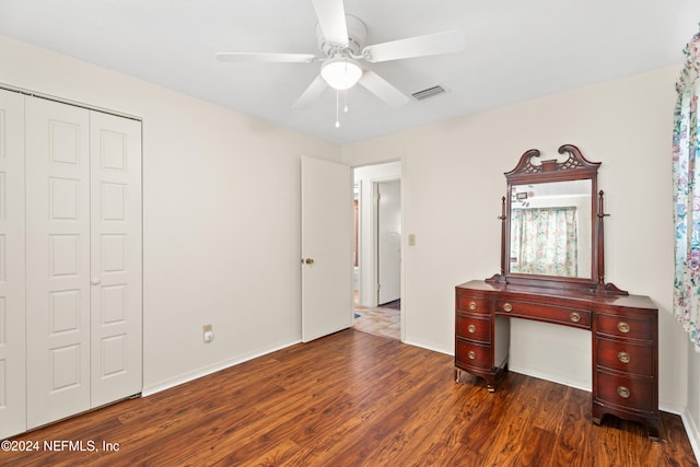 bedroom featuring a closet, ceiling fan, and dark wood-type flooring