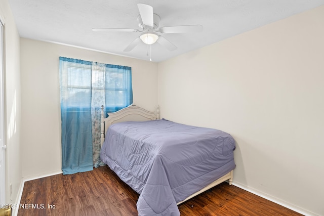 bedroom featuring ceiling fan and dark wood-type flooring