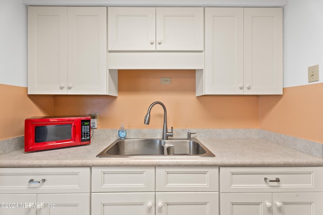 kitchen with white cabinets and sink