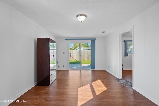 spare room with dark hardwood / wood-style flooring