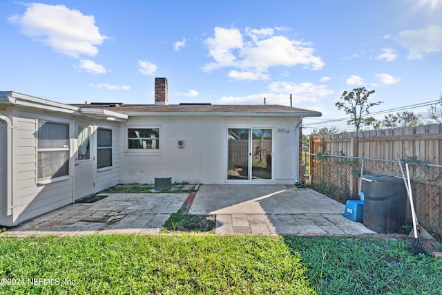 rear view of house featuring a patio