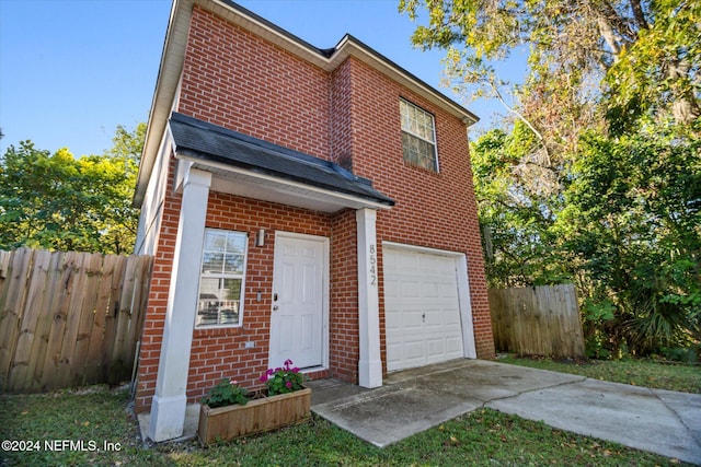 view of front of property featuring a garage