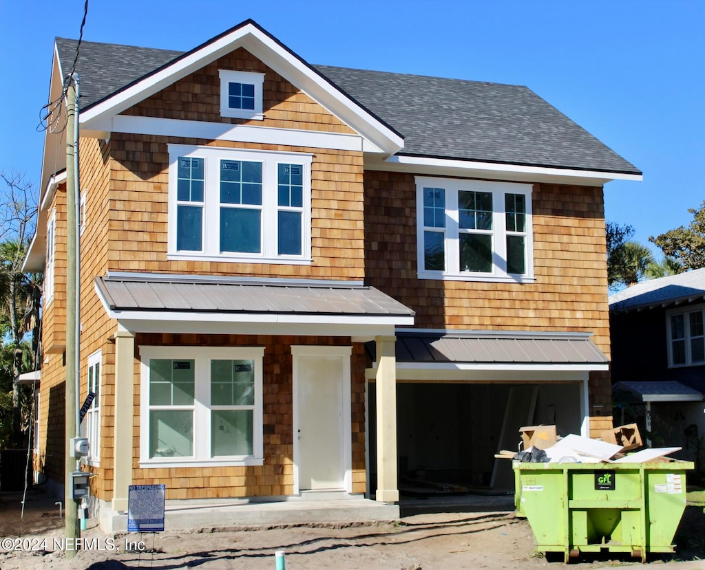 view of front of property with a garage