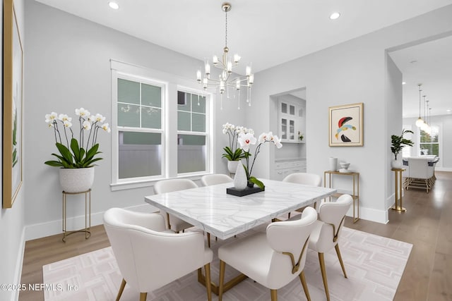 142 Ocean Blvd, Atlantic Beach, FL 32233 - dining space with a chandelier, recessed lighting, and wood finished floors