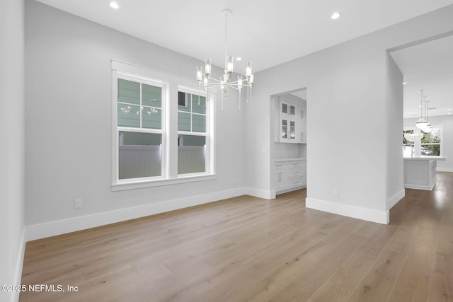 142 Ocean Blvd, Atlantic Beach, FL 32233 - unfurnished dining area featuring a chandelier, light wood-type flooring, and recessed lighting