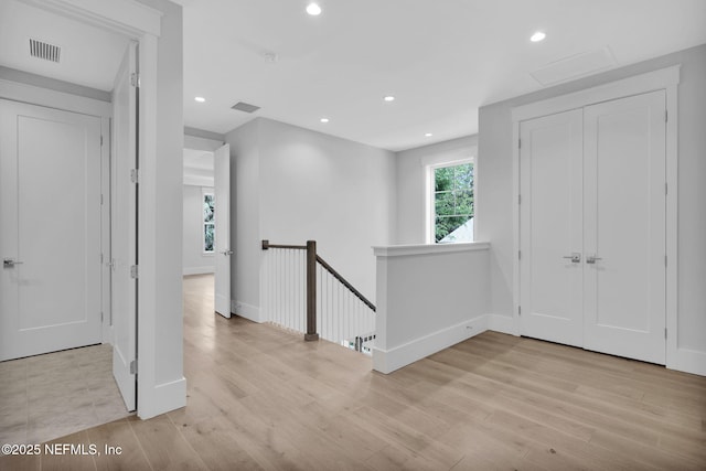 142 Ocean Blvd, Atlantic Beach, FL 32233 - hallway with an upstairs landing, light wood-style flooring, recessed lighting, and attic access