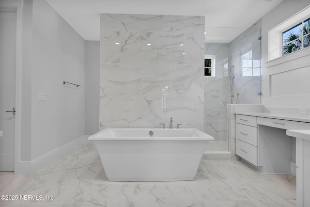 142 Ocean Blvd, Atlantic Beach, FL 32233 - bathroom featuring marble finish floors, a freestanding bath, and vanity