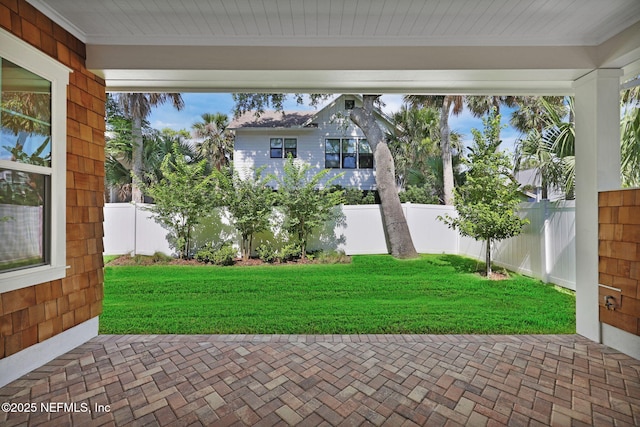 142 Ocean Blvd, Atlantic Beach, FL 32233 - fenced backyard with a patio area