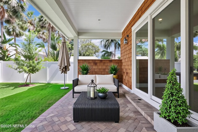 142 Ocean Blvd, Atlantic Beach, FL 32233 - fenced backyard with a patio area and an outdoor living space