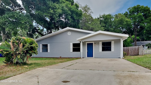 ranch-style home with a front yard