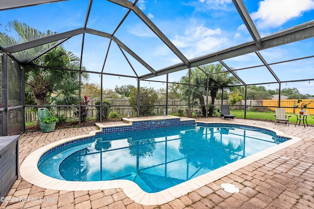 view of pool featuring a lanai and a patio