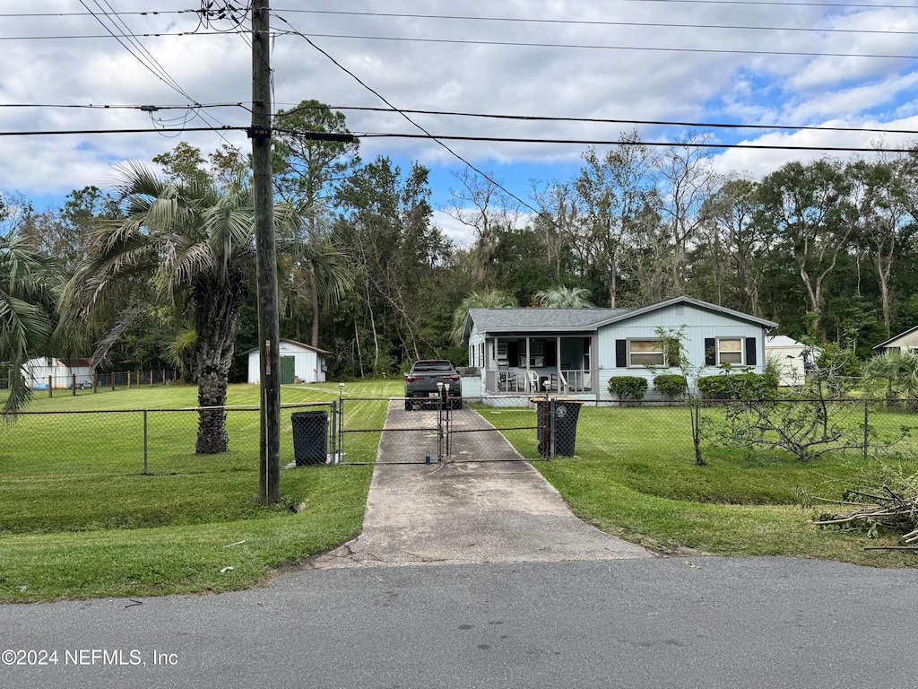 view of front of property with a front yard and a porch