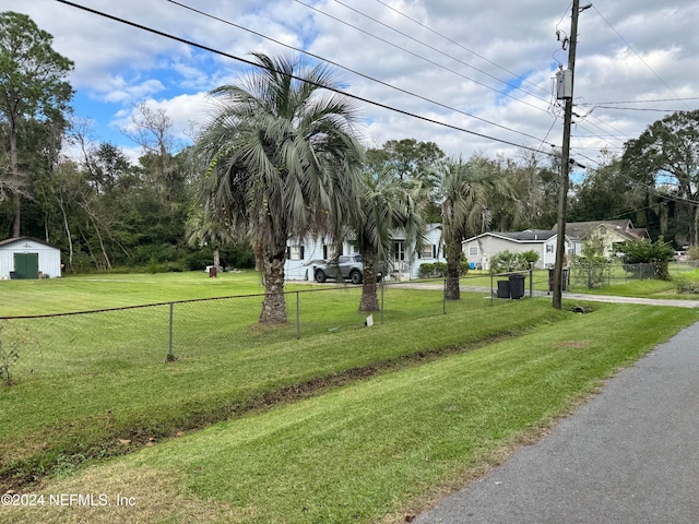 view of property's community with a yard