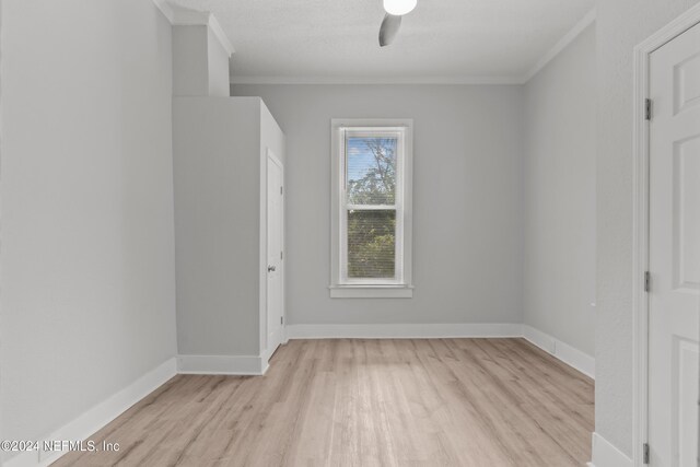 unfurnished bedroom featuring ceiling fan, light hardwood / wood-style floors, and crown molding