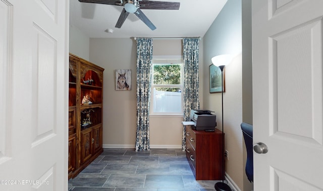 interior space featuring ceiling fan