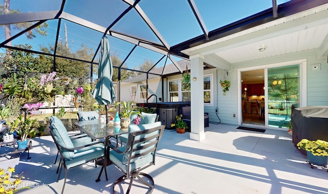 view of patio featuring a lanai