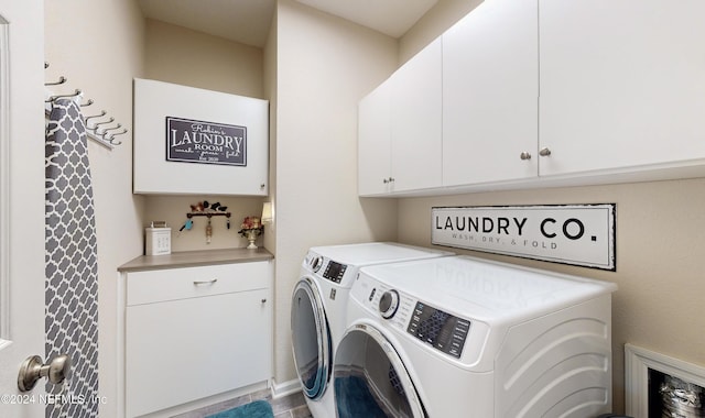 laundry area featuring cabinets and independent washer and dryer