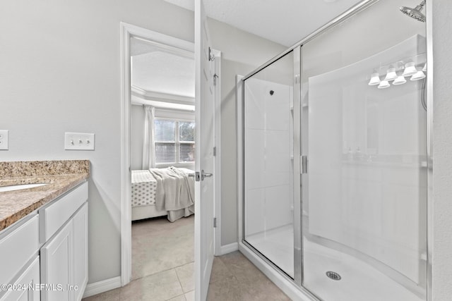 bathroom with vanity, a textured ceiling, and walk in shower