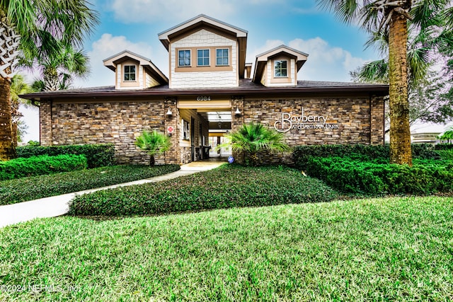 view of front of home with a front lawn