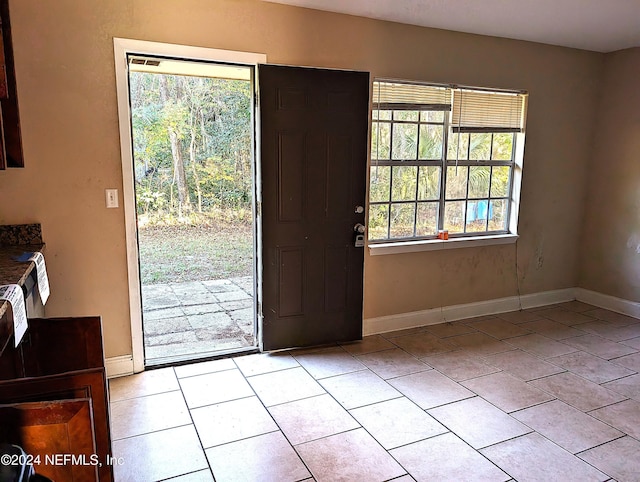 doorway featuring light tile patterned floors