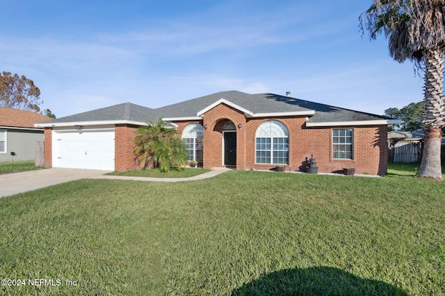 ranch-style home with a garage and a front lawn