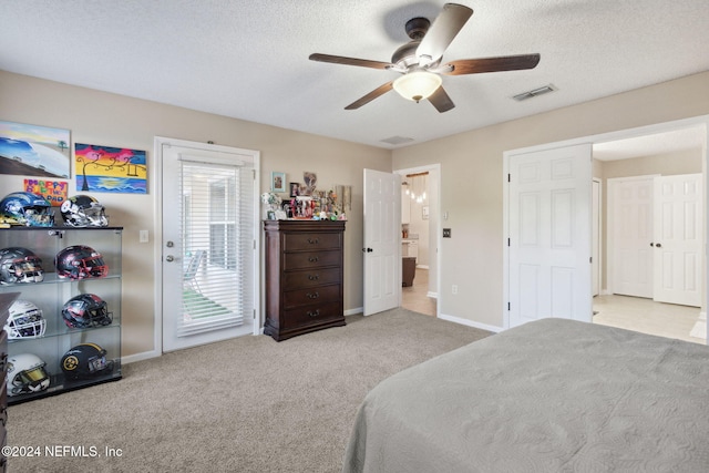 bedroom with access to exterior, light carpet, a textured ceiling, and ceiling fan