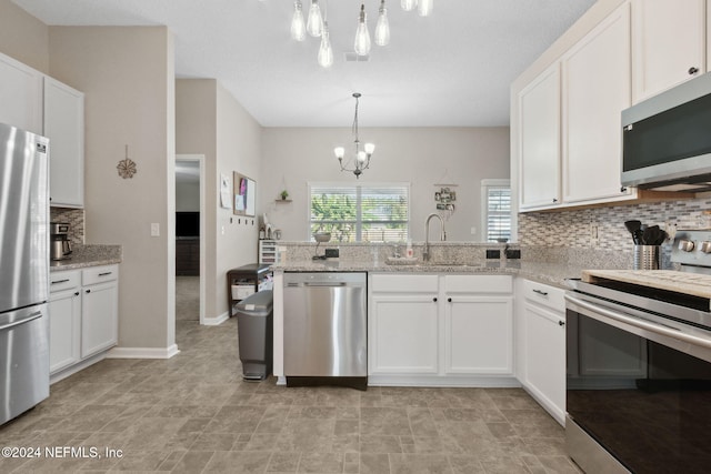 kitchen with sink, white cabinetry, and stainless steel appliances