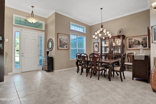 tiled dining room featuring ornamental molding, a high ceiling, and a notable chandelier