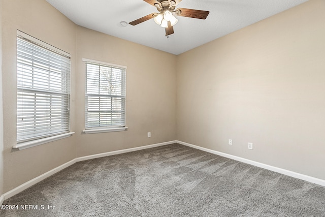 carpeted empty room with ceiling fan