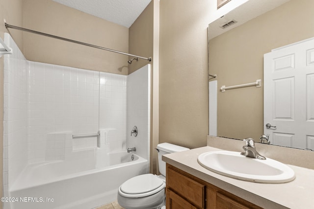 full bathroom with vanity, toilet, a textured ceiling, and bathtub / shower combination