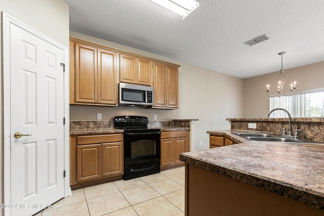 kitchen featuring black electric range oven, an inviting chandelier, sink, light tile patterned floors, and decorative light fixtures