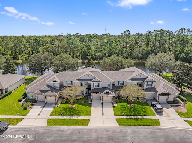 birds eye view of property with a water view