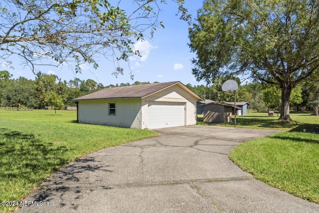 view of home's exterior featuring a yard and a garage