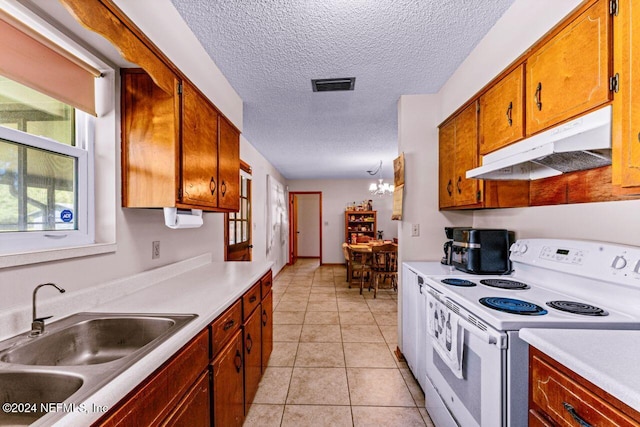 kitchen featuring sink, white electric range oven, an inviting chandelier, a textured ceiling, and light tile patterned flooring