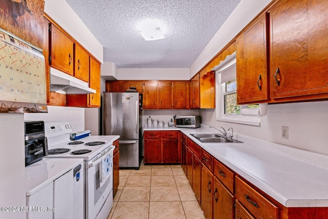 kitchen with a textured ceiling, sink, light tile patterned floors, white electric range, and stainless steel refrigerator