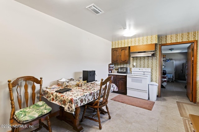 dining room featuring light tile patterned floors