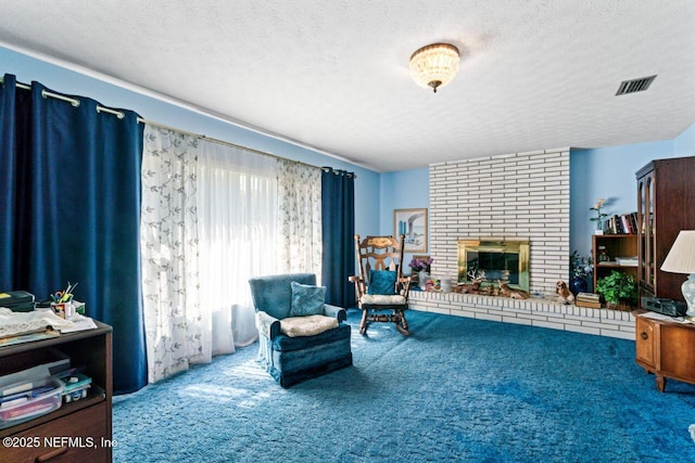 living area with a brick fireplace, a textured ceiling, and carpet flooring