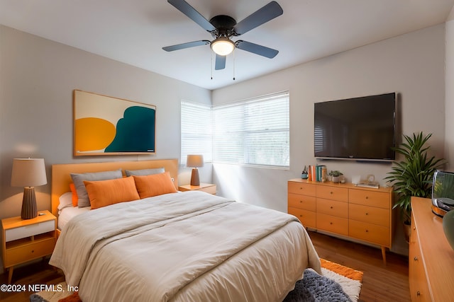 bedroom featuring hardwood / wood-style floors and ceiling fan