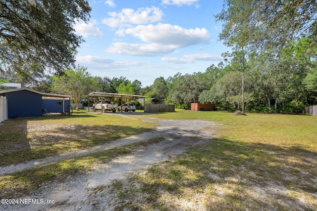 view of yard featuring a carport