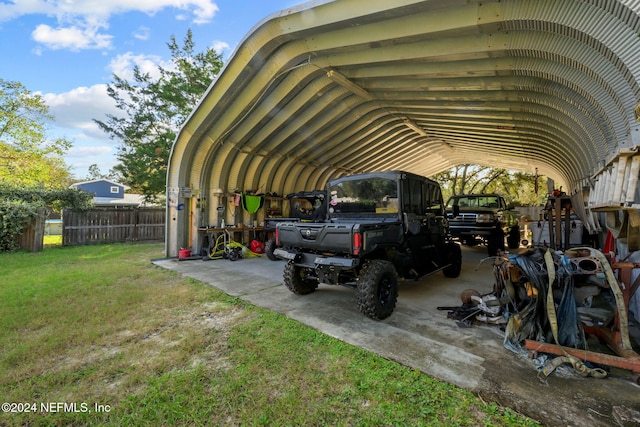 view of car parking featuring a carport and a lawn