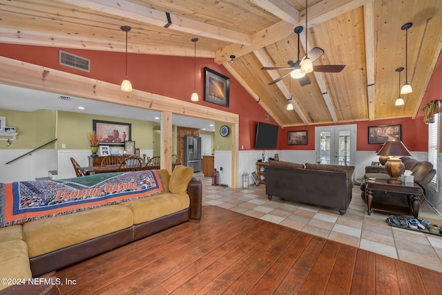 living room with french doors, tile patterned floors, ceiling fan, high vaulted ceiling, and beamed ceiling