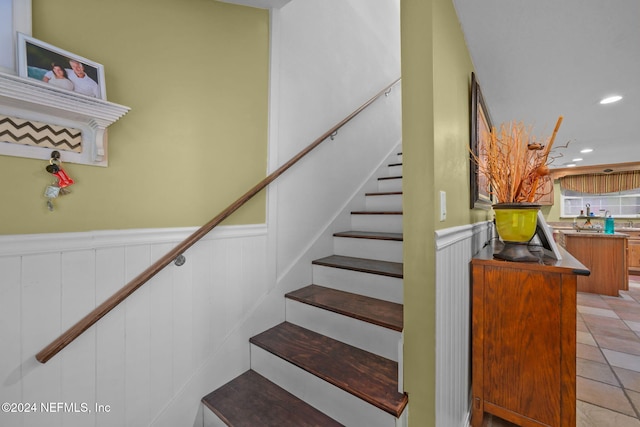 staircase with tile patterned flooring