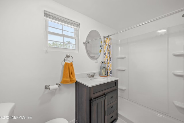 bathroom featuring a shower with curtain, toilet, and vanity